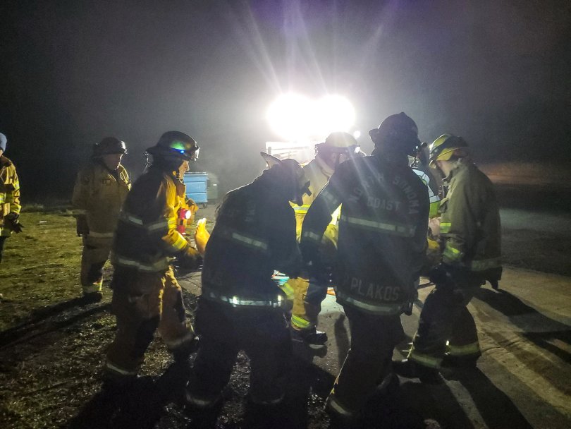 Carrying the “patient” away on a backboard.