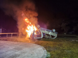 After fire extinguished, cars set on fire again.