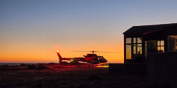 REACH waits for patient at LZ on bluff trail