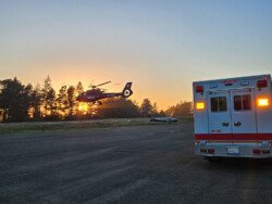 REACH departs with a patient at sunset